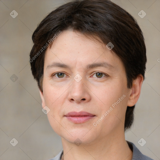 Joyful white adult female with short  brown hair and brown eyes