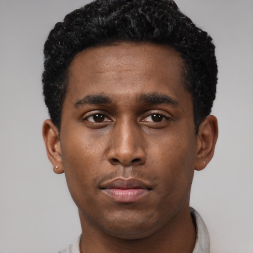 Neutral black young-adult male with short  black hair and brown eyes
