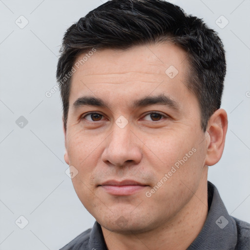 Joyful white adult male with short  brown hair and brown eyes