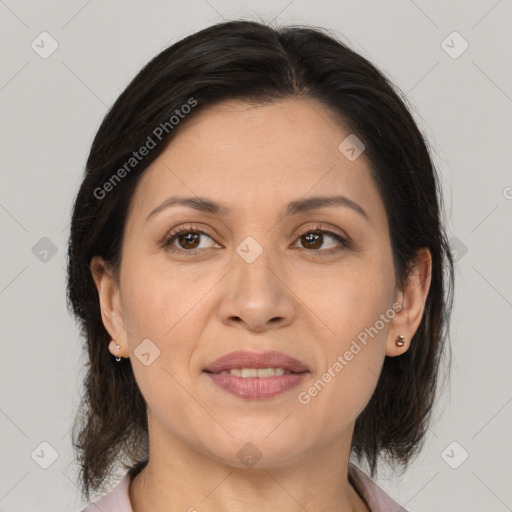 Joyful white adult female with medium  brown hair and brown eyes