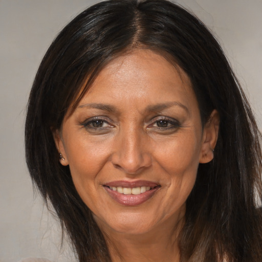 Joyful asian adult female with medium  brown hair and brown eyes