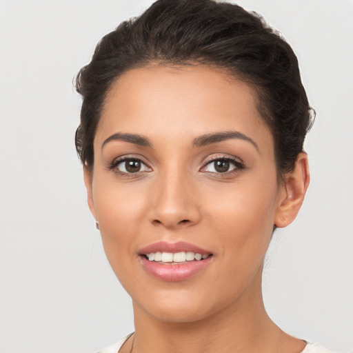 Joyful white young-adult female with long  brown hair and brown eyes