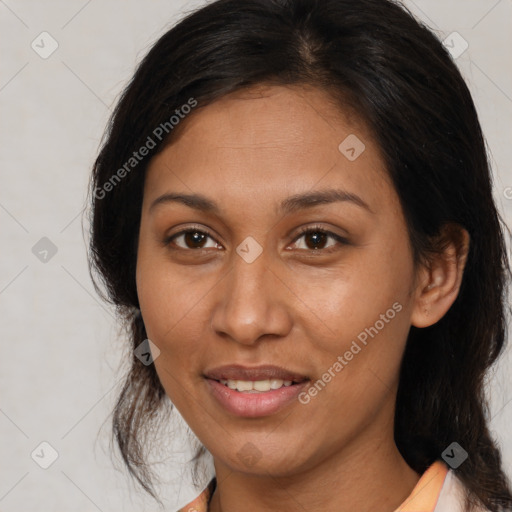 Joyful latino young-adult female with medium  brown hair and brown eyes