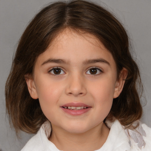 Joyful white child female with medium  brown hair and brown eyes