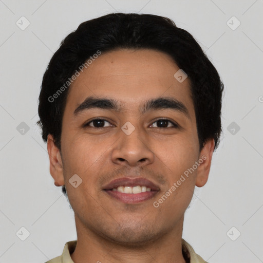 Joyful latino young-adult male with short  black hair and brown eyes