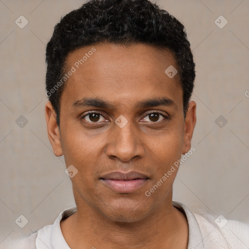 Joyful black young-adult male with short  black hair and brown eyes