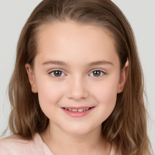 Joyful white child female with long  brown hair and brown eyes