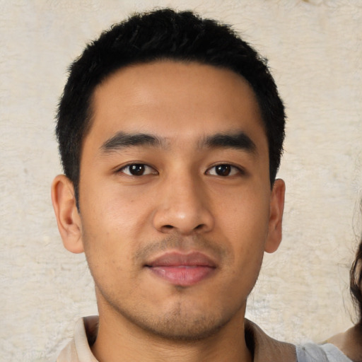 Neutral latino young-adult male with short  black hair and brown eyes