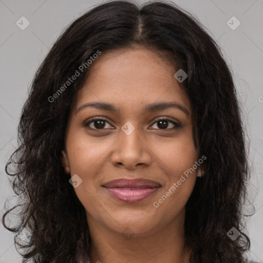 Joyful black young-adult female with long  brown hair and brown eyes