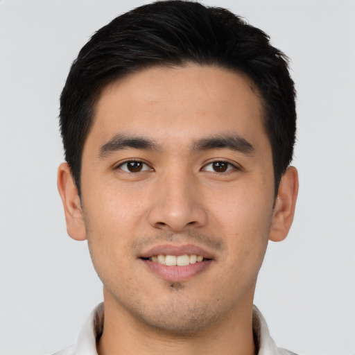 Joyful asian young-adult male with short  brown hair and brown eyes