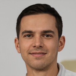 Joyful white young-adult male with short  brown hair and brown eyes