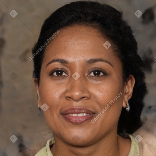 Joyful black adult female with short  brown hair and brown eyes