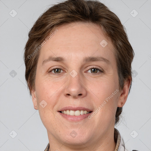 Joyful white adult female with short  brown hair and grey eyes