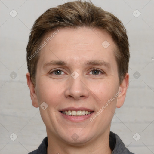 Joyful white adult male with short  brown hair and grey eyes