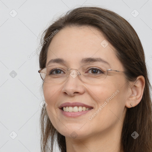 Joyful white adult female with long  brown hair and brown eyes