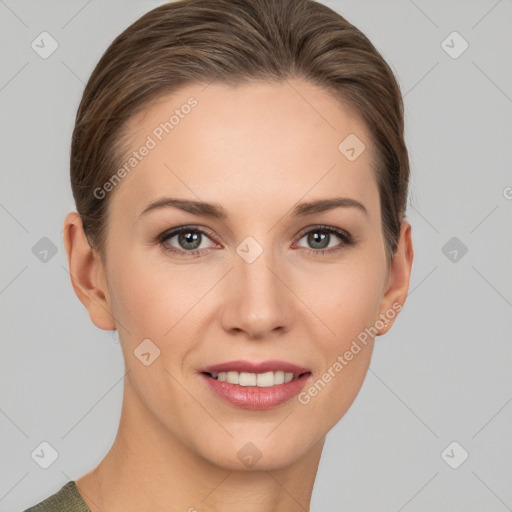 Joyful white young-adult female with medium  brown hair and grey eyes