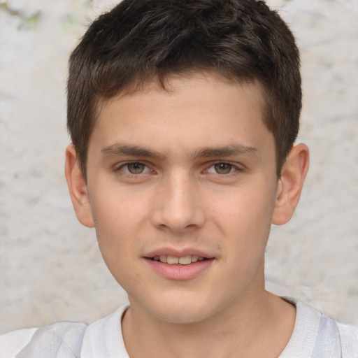 Joyful white child male with short  brown hair and brown eyes