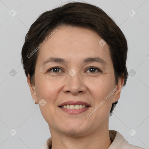 Joyful white adult female with short  brown hair and brown eyes