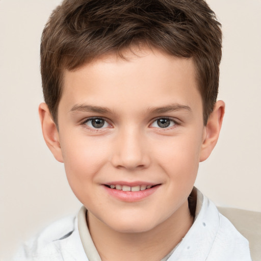 Joyful white child male with short  brown hair and brown eyes