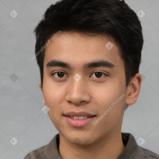 Joyful asian young-adult male with short  black hair and brown eyes