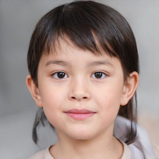 Joyful white child female with medium  brown hair and brown eyes