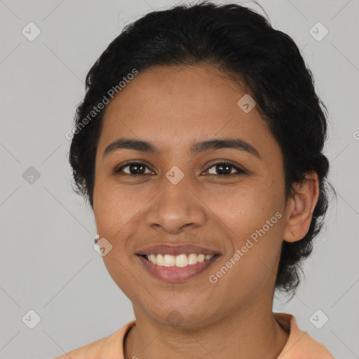 Joyful latino young-adult female with short  brown hair and brown eyes