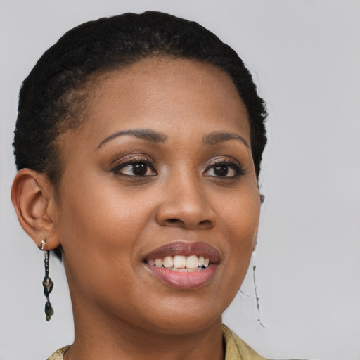 Joyful black young-adult female with short  brown hair and brown eyes