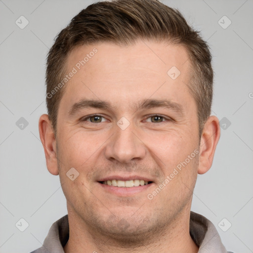 Joyful white adult male with short  brown hair and brown eyes