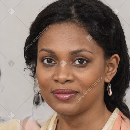 Joyful black young-adult female with medium  brown hair and brown eyes