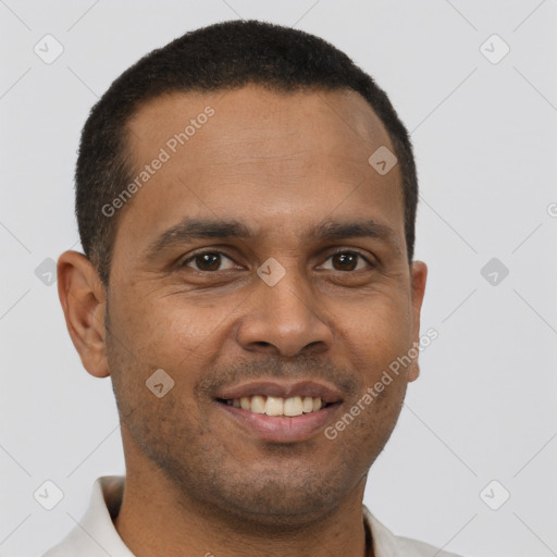 Joyful black young-adult male with short  brown hair and brown eyes