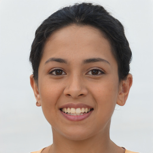 Joyful asian young-adult female with short  brown hair and brown eyes