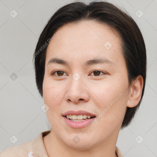 Joyful asian young-adult female with medium  brown hair and brown eyes