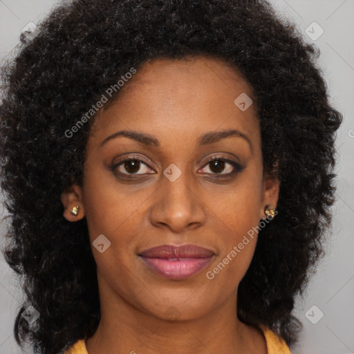 Joyful black young-adult female with long  brown hair and brown eyes