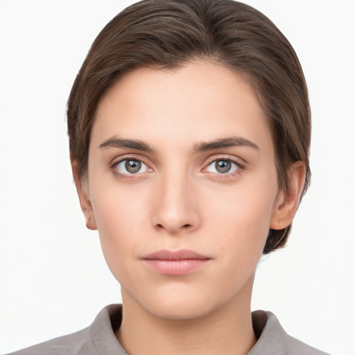 Neutral white young-adult female with short  brown hair and brown eyes