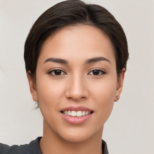 Joyful white young-adult female with short  brown hair and brown eyes