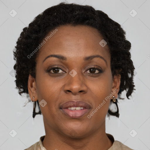 Joyful black adult female with short  brown hair and brown eyes