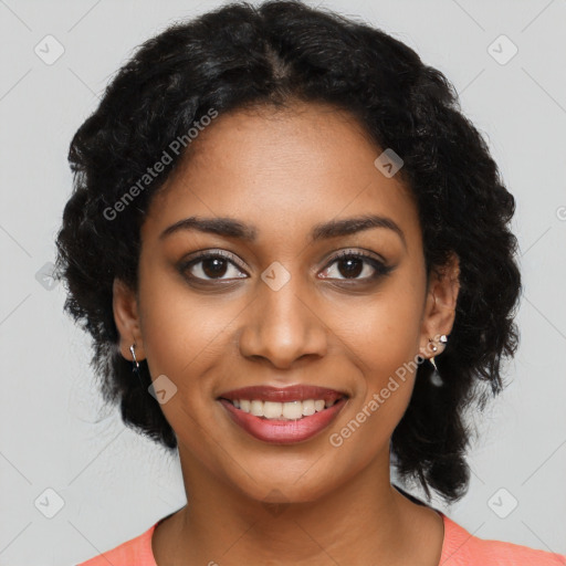 Joyful black young-adult female with long  black hair and brown eyes