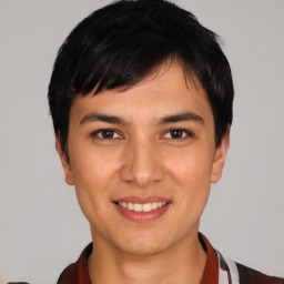 Joyful white young-adult male with short  black hair and brown eyes