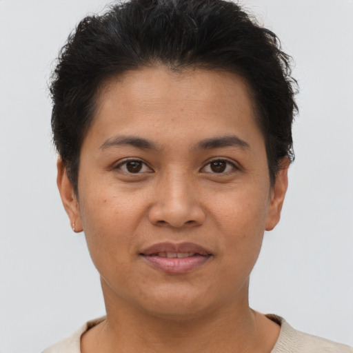 Joyful asian young-adult female with short  brown hair and brown eyes
