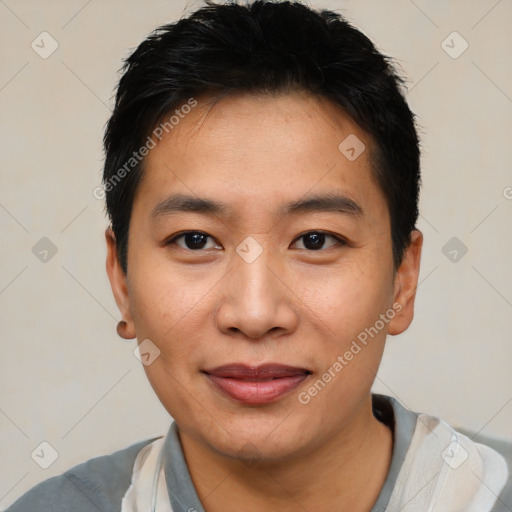 Joyful asian young-adult male with short  black hair and brown eyes