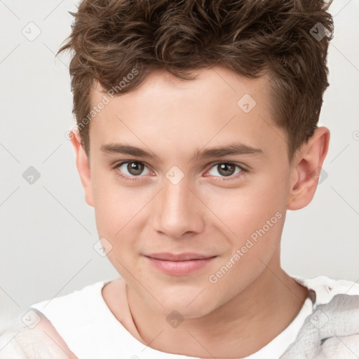 Joyful white child male with short  brown hair and brown eyes