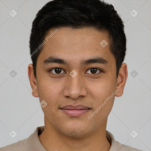 Joyful latino young-adult male with short  brown hair and brown eyes