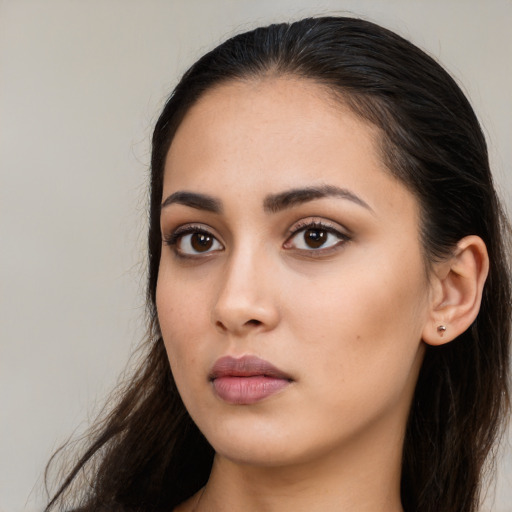 Neutral white young-adult female with long  brown hair and brown eyes