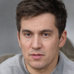 Neutral white adult male with short  brown hair and brown eyes