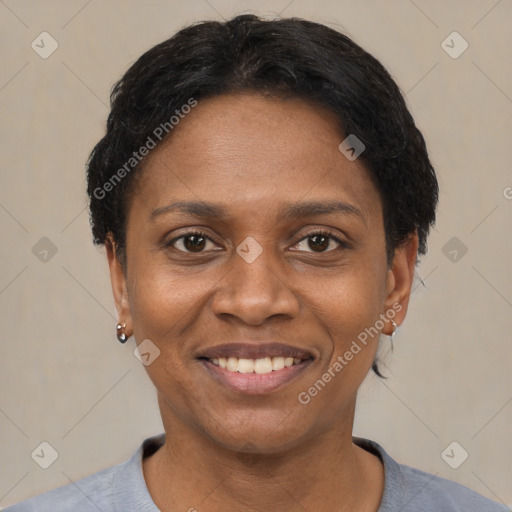 Joyful black young-adult female with short  black hair and brown eyes