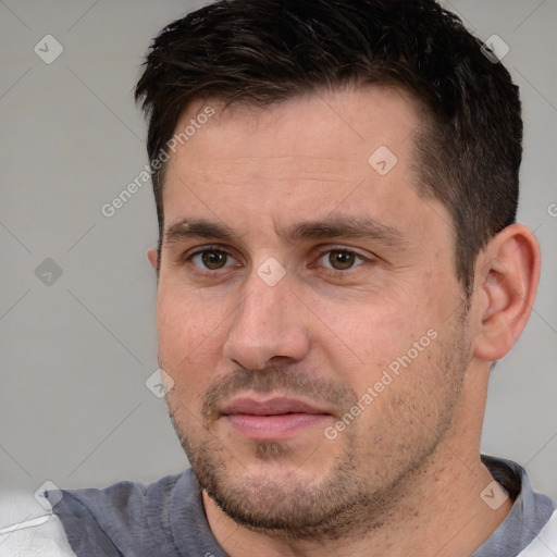 Joyful white adult male with short  brown hair and brown eyes