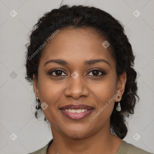 Joyful black young-adult female with long  brown hair and brown eyes