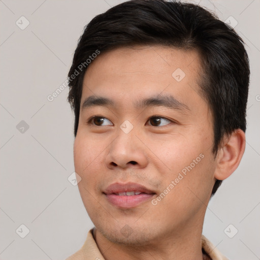 Joyful asian young-adult male with short  brown hair and brown eyes