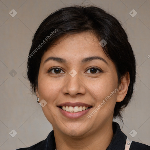 Joyful asian adult female with medium  brown hair and brown eyes