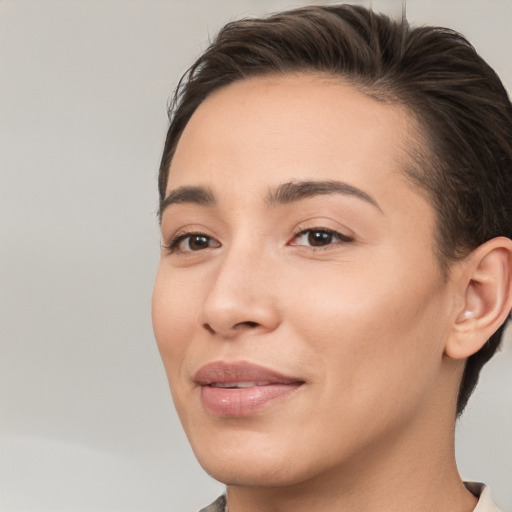 Joyful white young-adult female with short  brown hair and brown eyes